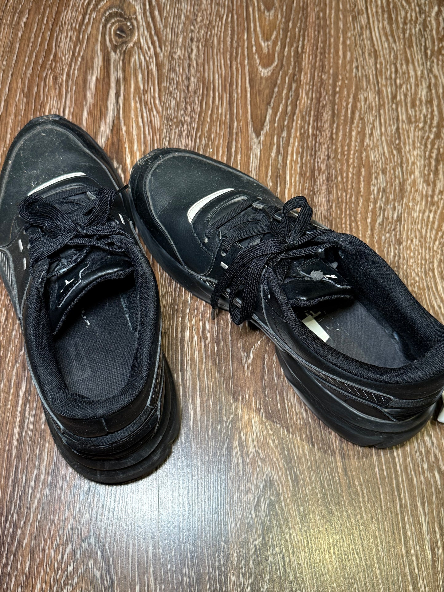 Black Puma trainers with white stripes