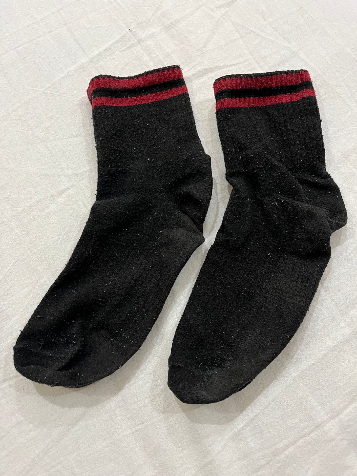 Black crew socks with red stripes