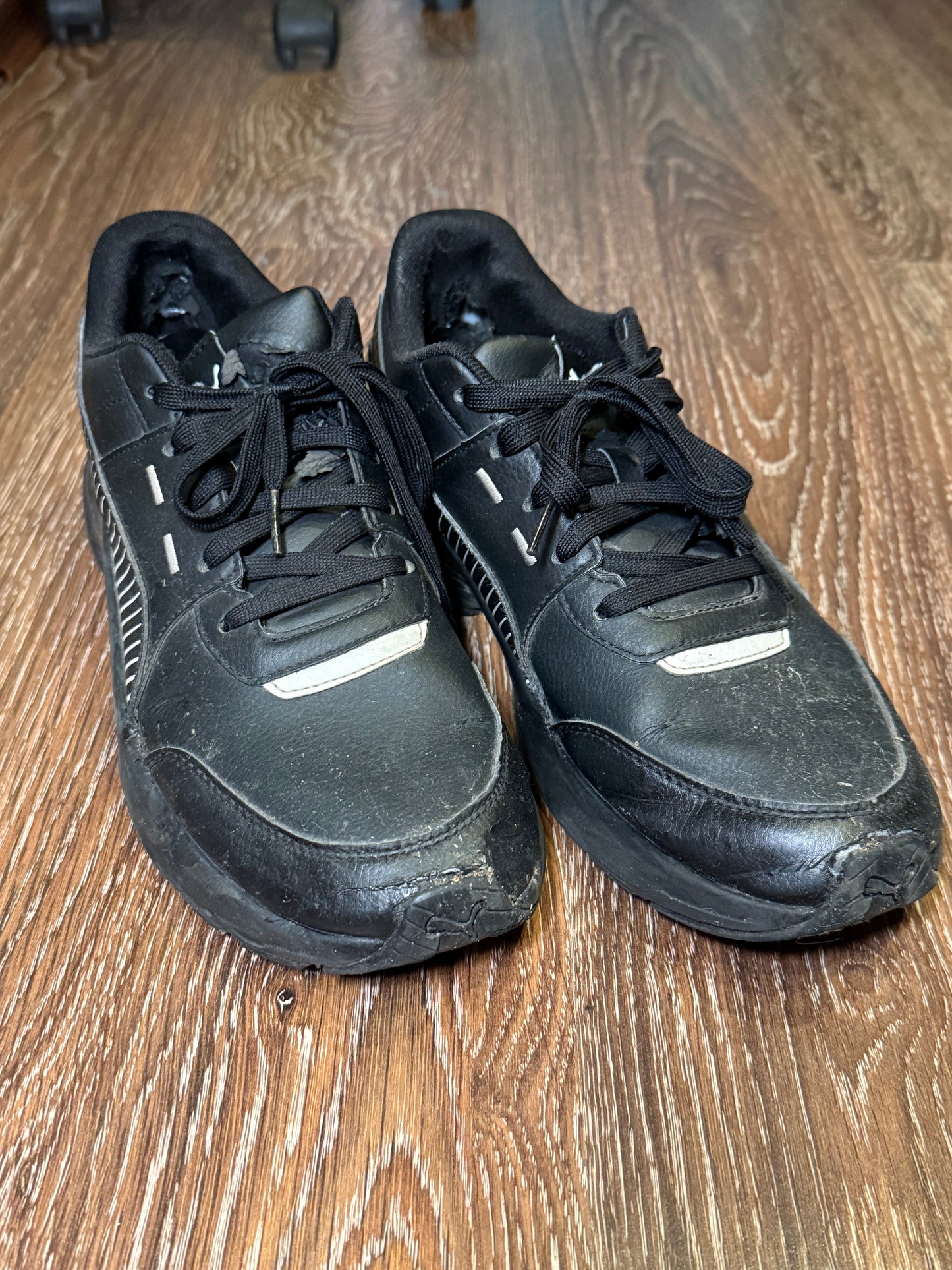Black Puma trainers with white stripes
