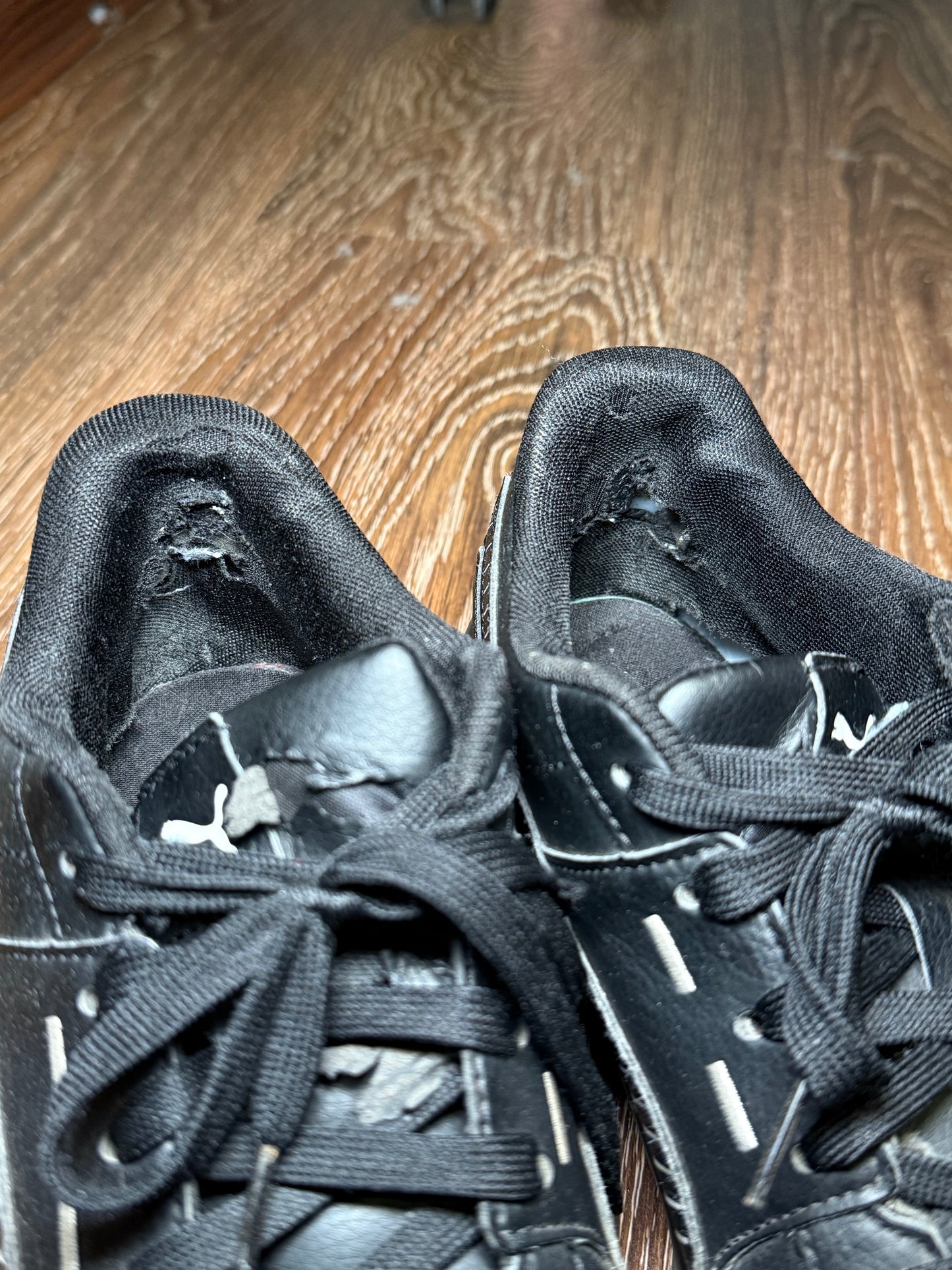 Black Puma trainers with white stripes